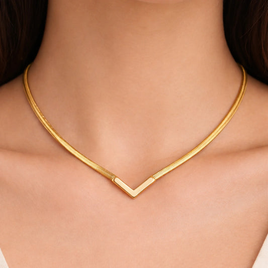 Gold necklace on a model's neck