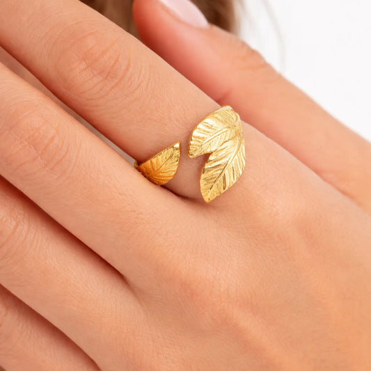 YUBIRAA gold leaf adjustable ring worn on finger with engraved leaf texture, minimal everyday jewellery