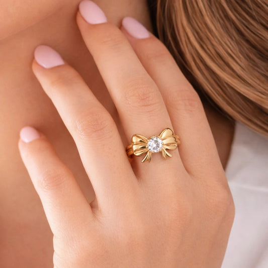Model wearing anti-tarnish adjustable bow-design gold ring with solitaire stone – YUBIRAA
