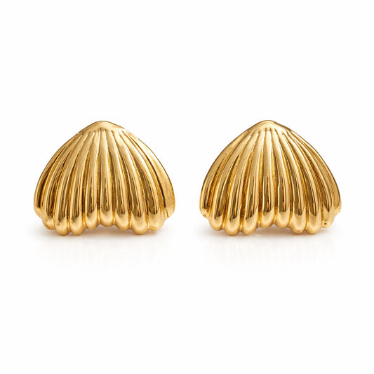 Pair of gold shell-shaped earrings on a white background