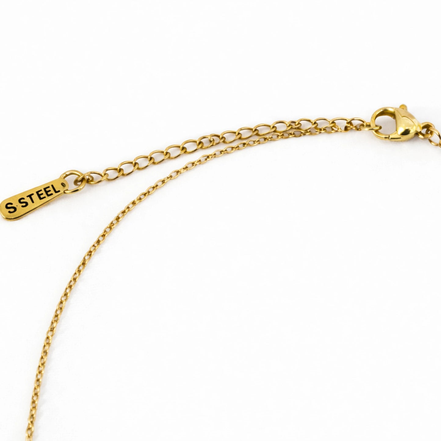 Gold chain bracelet with a tag labeled 'S Steel' on a white background