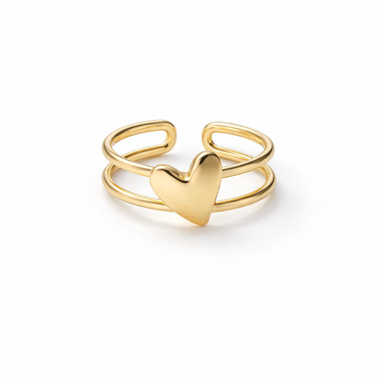 Gold heart-shaped ring on a white background