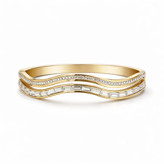 Gold bracelet with diamond accents on a white background