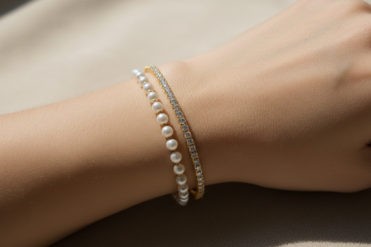 Diamond bracelet vs pearl bracelet comparison — sparkling diamond-inspired bracelet and delicate pearl bracelet by YUBIRAA, anti-tarnish 18K gold PVD plating
