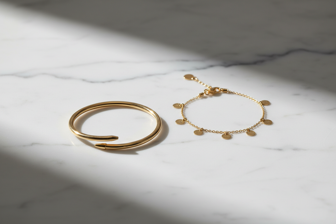 Nail bracelet vs charm bracelet comparison — sleek gold nail bracelet and delicate charm bracelet by YUBIRAA, anti-tarnish 18K gold PVD plating