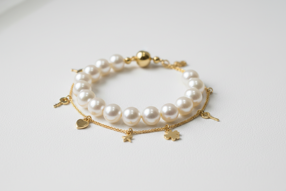 Pearl bracelet vs charm bracelet comparison — delicate pearl bracelet and charm bracelet with decorative charms by YUBIRAA, anti-tarnish 18K gold PVD plating