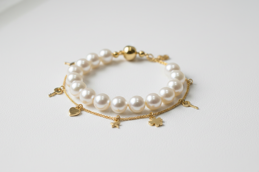 Pearl bracelet vs charm bracelet comparison — delicate pearl bracelet and charm bracelet with decorative charms by YUBIRAA, anti-tarnish 18K gold PVD plating