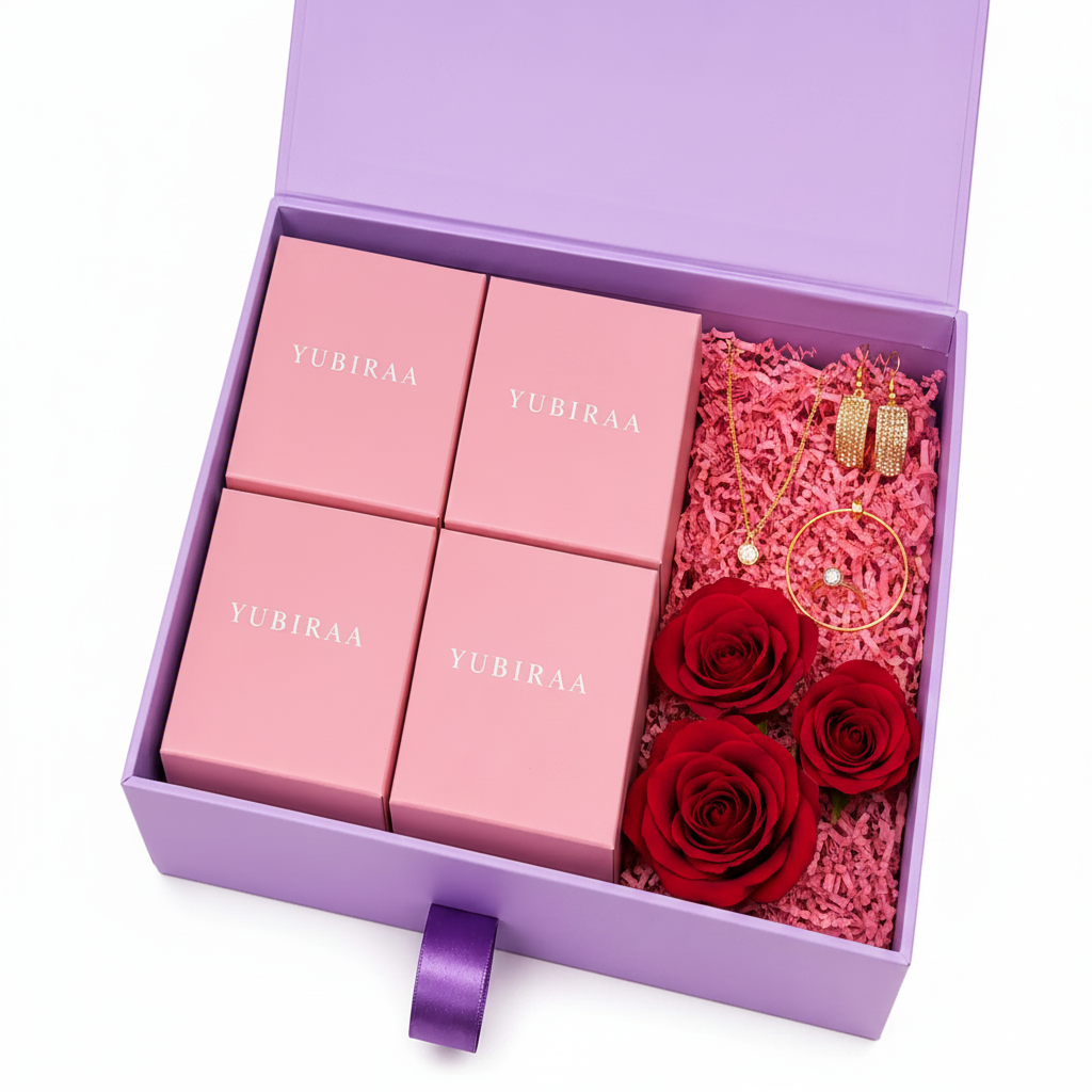 YUBIRAA Valentine's Day jewellery hamper — lavender gift box with pink YUBIRAA jewellery boxes and gold-toned earrings, necklace, bracelet and ring, perfect personalised jewellery gift for girlfriend or