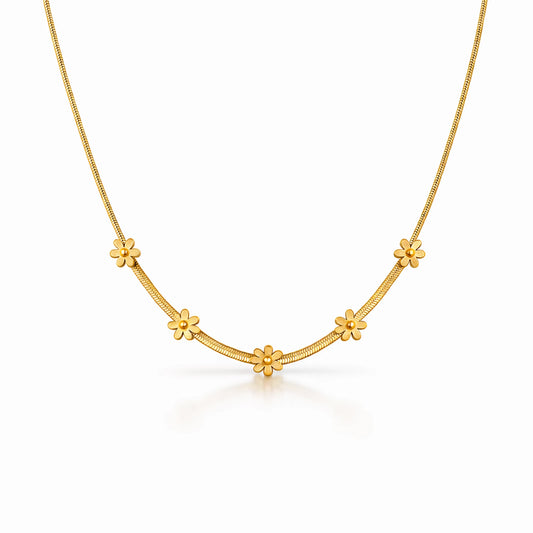 Gold necklace with floral designs on a white background