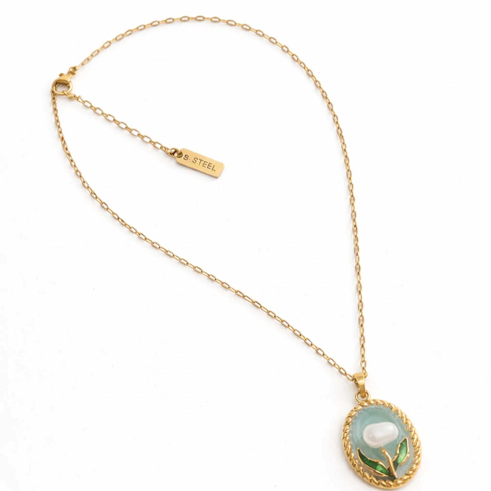 Anti tarnish gold plated floral pendant necklace with stainless steel chain and S.STEEL engraved tag displayed in a clean flat lay on white background.