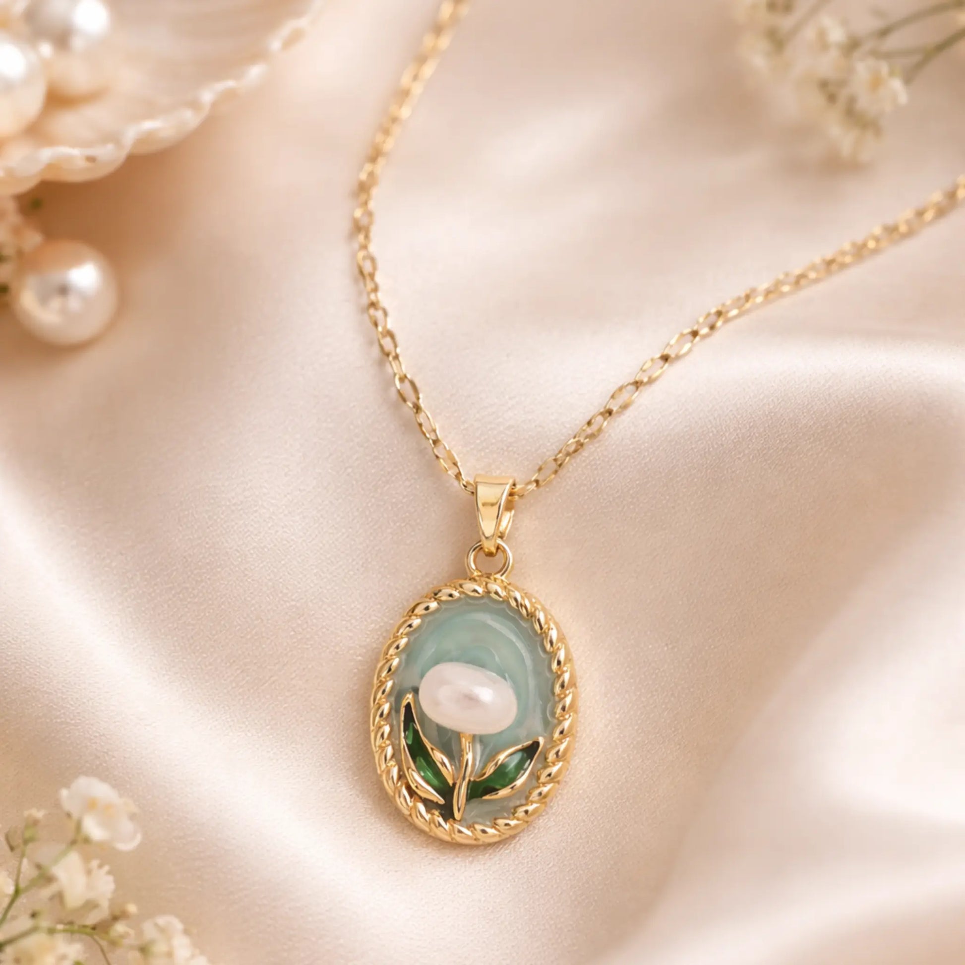 Anti tarnish gold plated floral pendant necklace styled on satin fabric with soft pearl accents for an elegant lifestyle jewelry look.