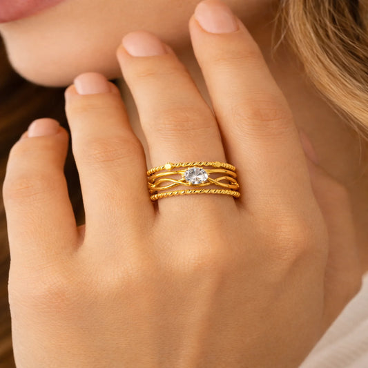 Model wearing Yubiraa adjustable gold unbroken love solitaire ring on finger showing elegant fit and everyday styling