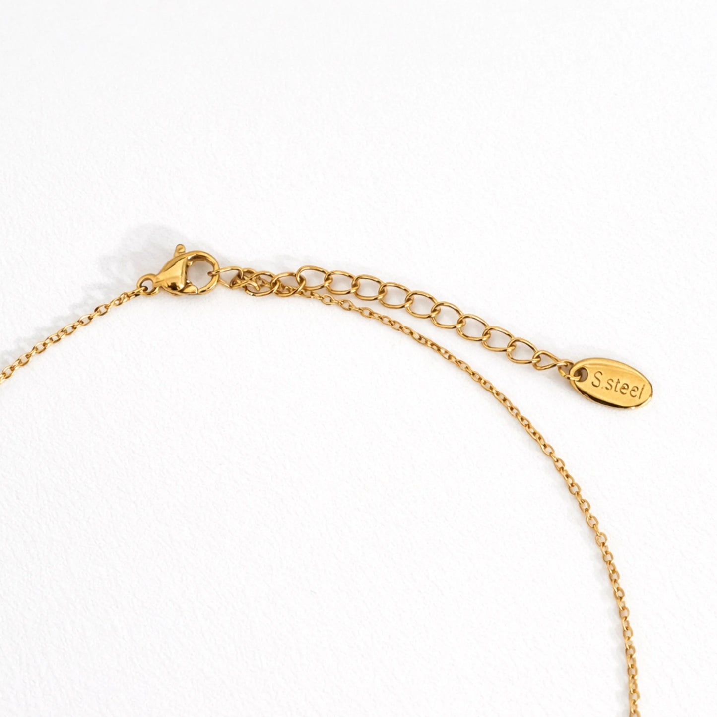 Gold necklace with a clasp on a white background