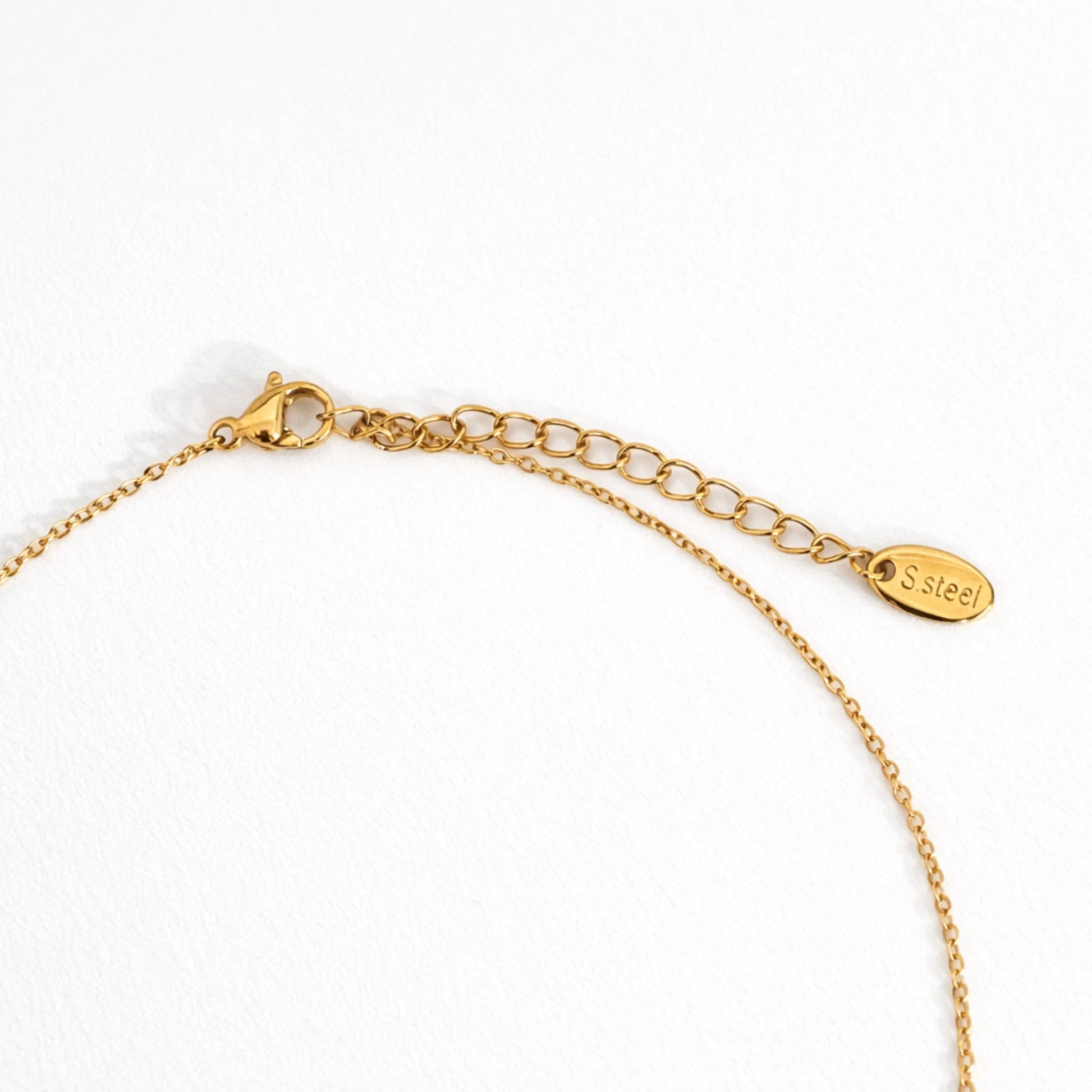 Gold necklace with a clasp on a white background