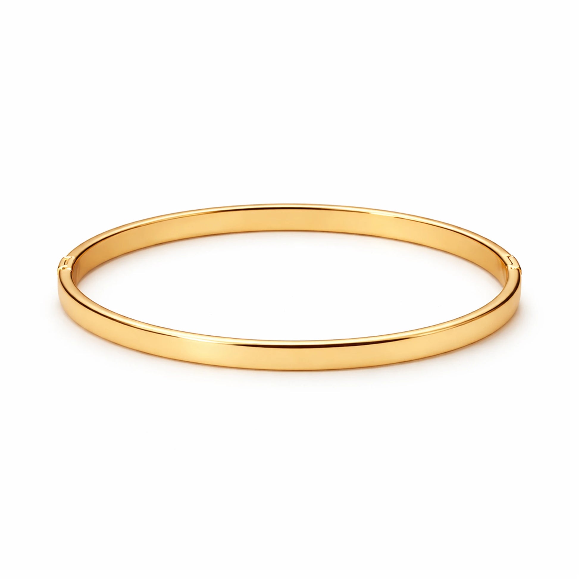 Gold bangle on a white background