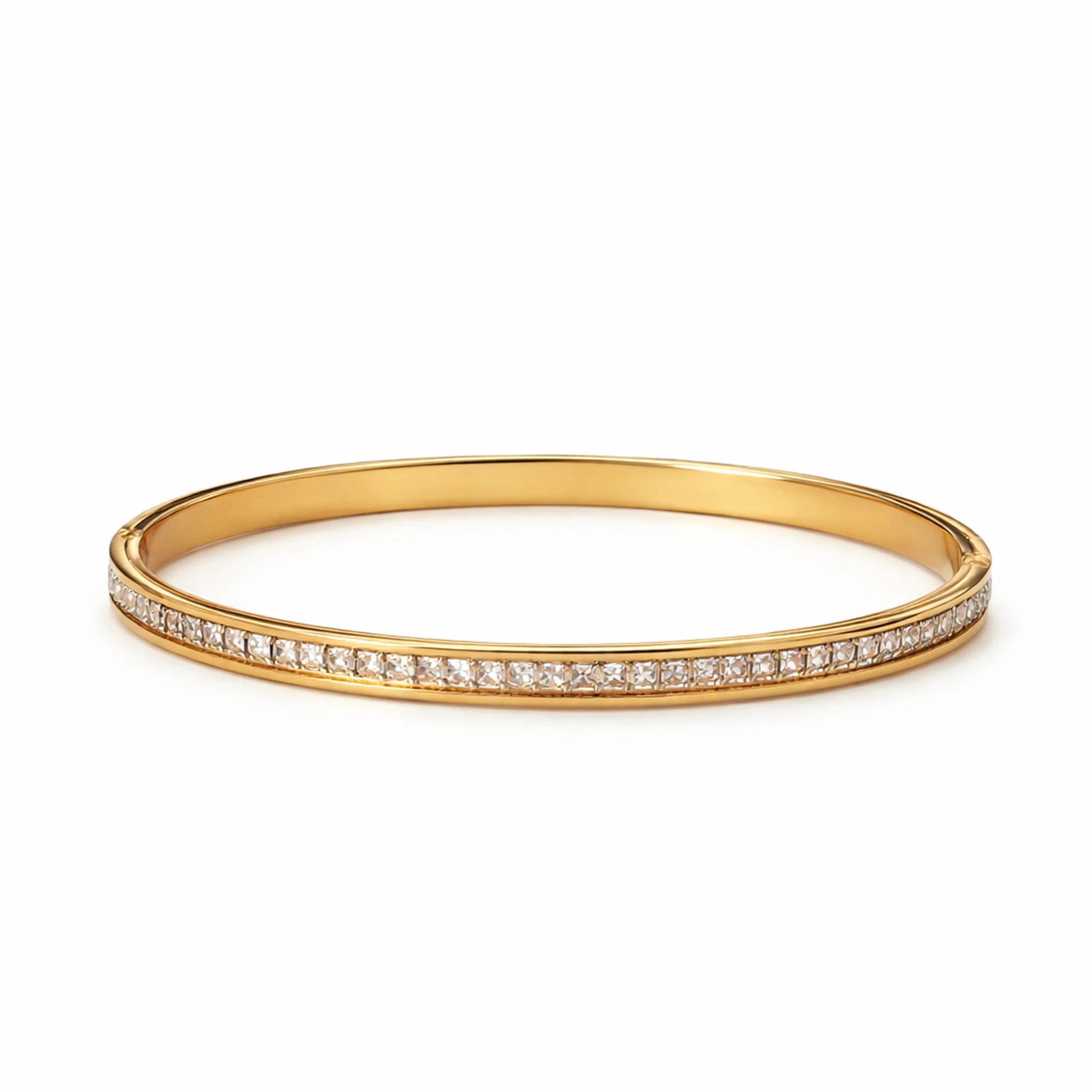 Gold bangle with small diamonds on a white background