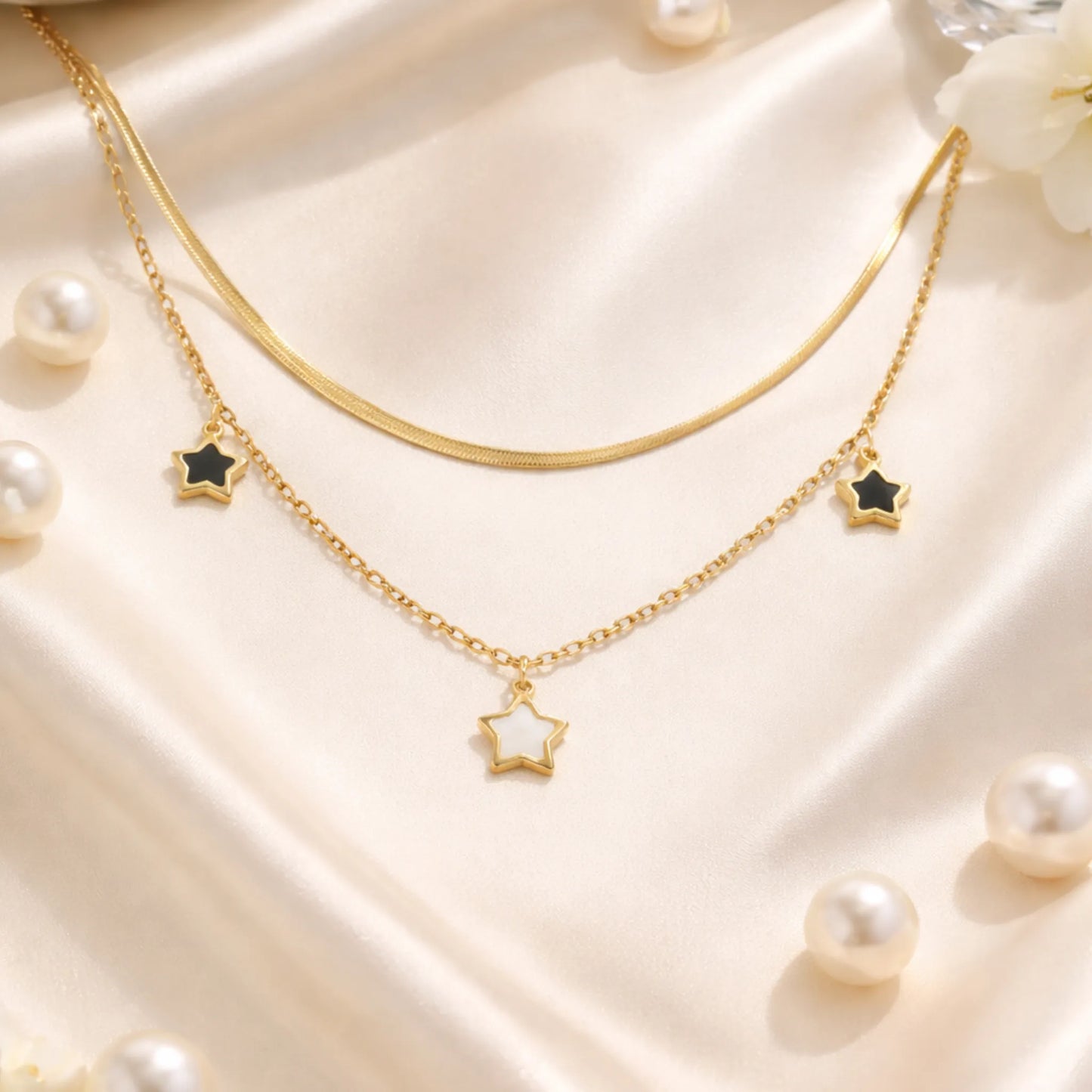 YUBIRAA star layered necklace styled on satin fabric with pearls, elegant anti tarnish jewellery