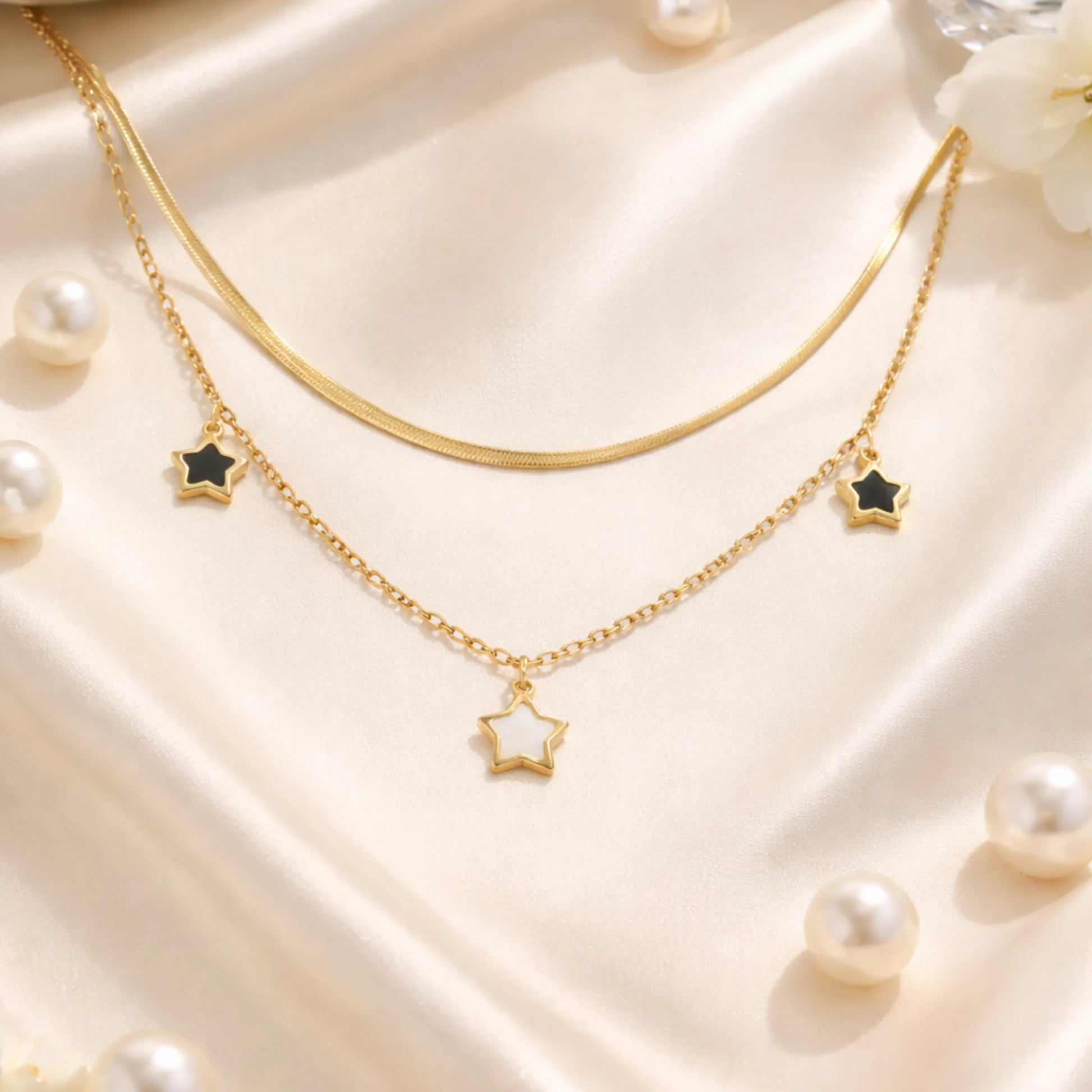 YUBIRAA star layered necklace styled on satin fabric with pearls, elegant anti tarnish jewellery
