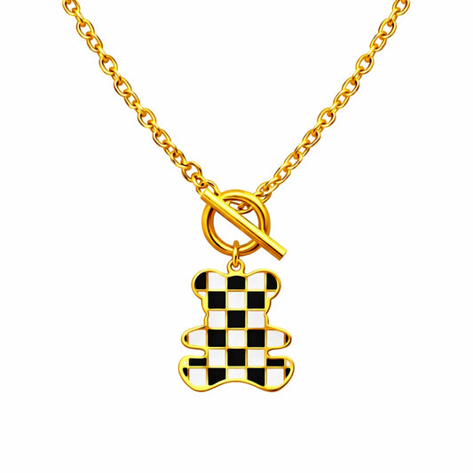 Checker teddy pendant necklace in anti tarnish gold plated finish with black and white enamel design
