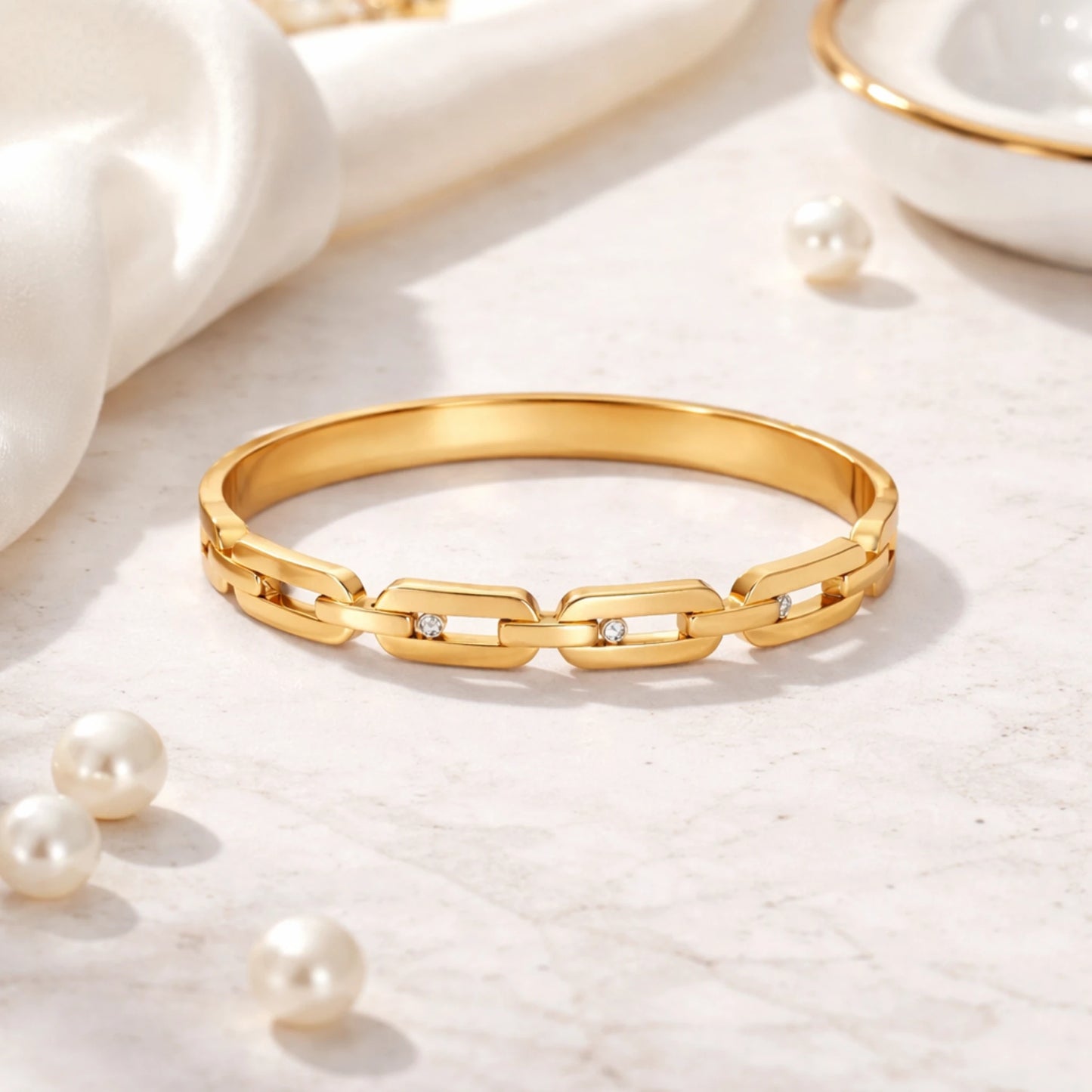yubiraa anti tarnish Gold plated bracelet with diamond accents on a light background with pearls