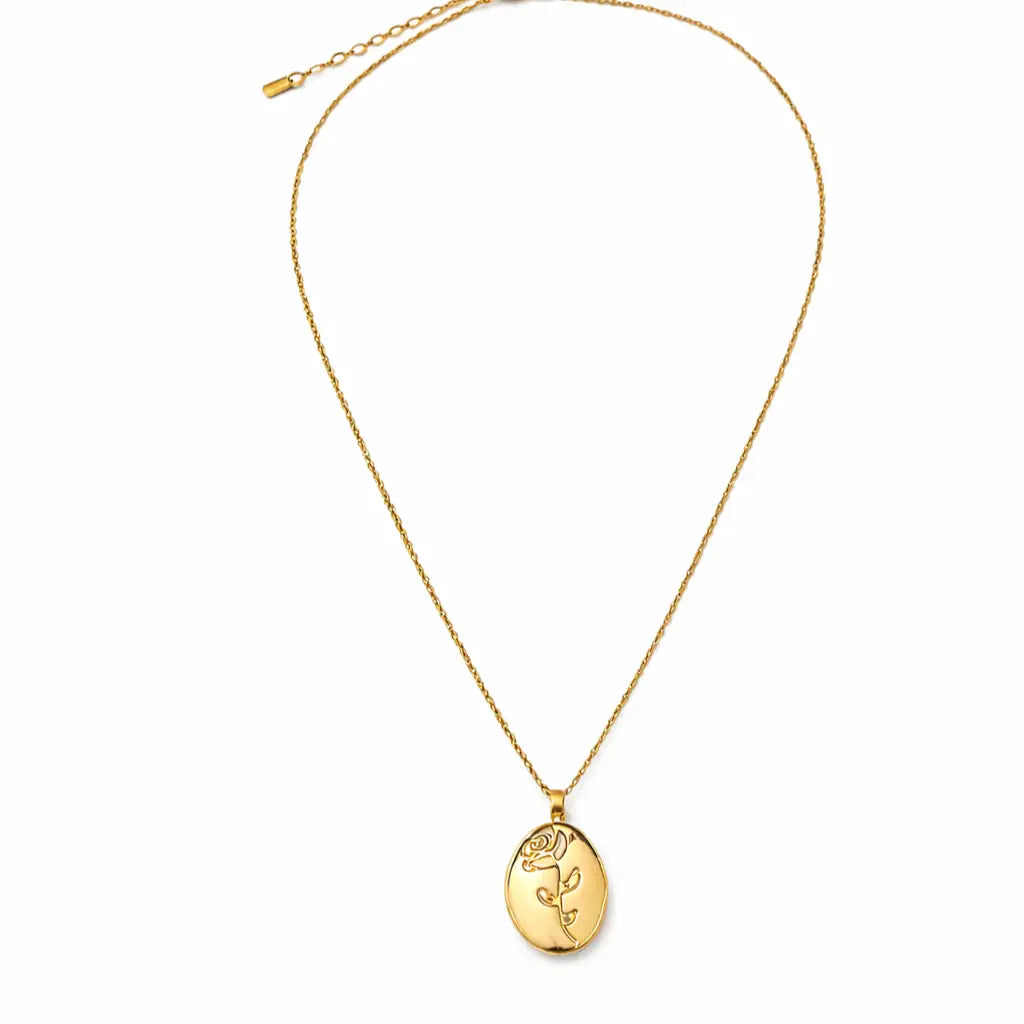 Gold oval pendant necklace with engraved rose design, minimal elegant jewelry