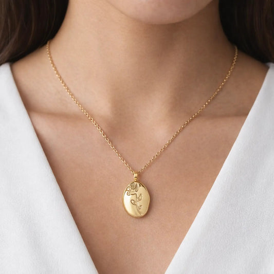 Gold oval rose pendant necklace worn on neck, minimal everyday gold jewelry