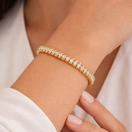 yubiraa anti tarnish Gold bracelet with clear stones on a wrist against a neutral background