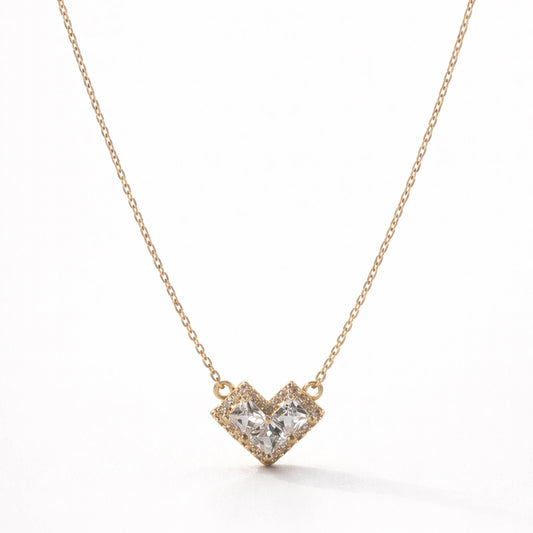 Heart-shaped diamond necklace on a white background