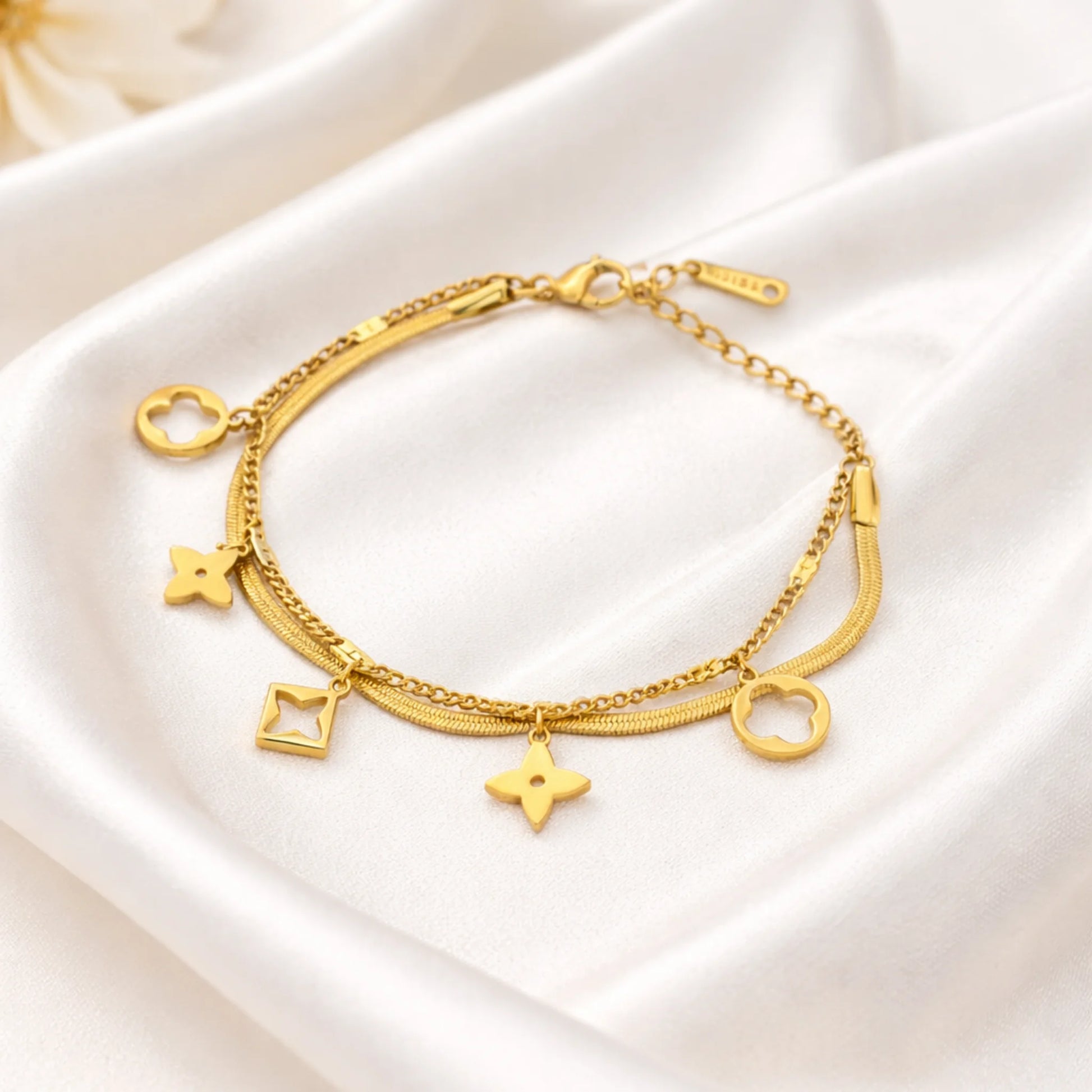 YUBIRAA Daily Glow Charm Bracelet styled for everyday wear with soft elegant background