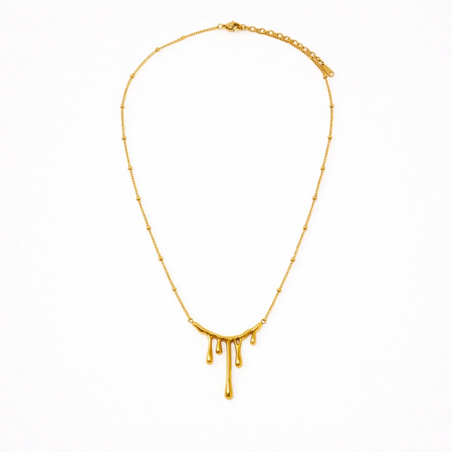 Gold necklace with a unique design on a white background