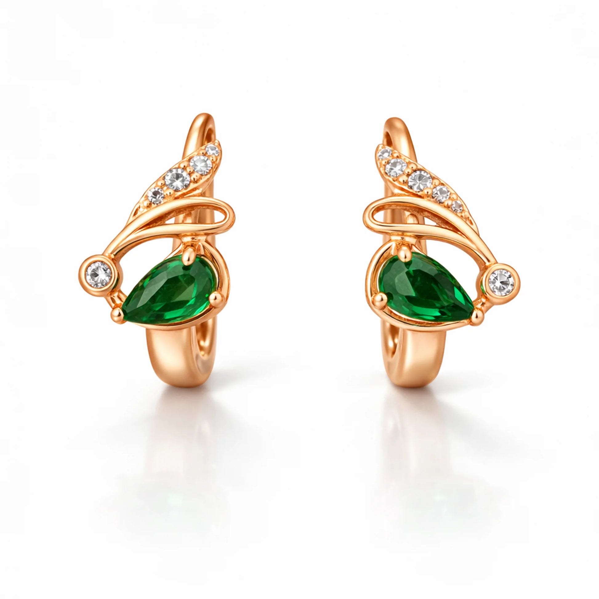 Rose gold huggie hoop earrings showing secure clasp closure and green stone setting