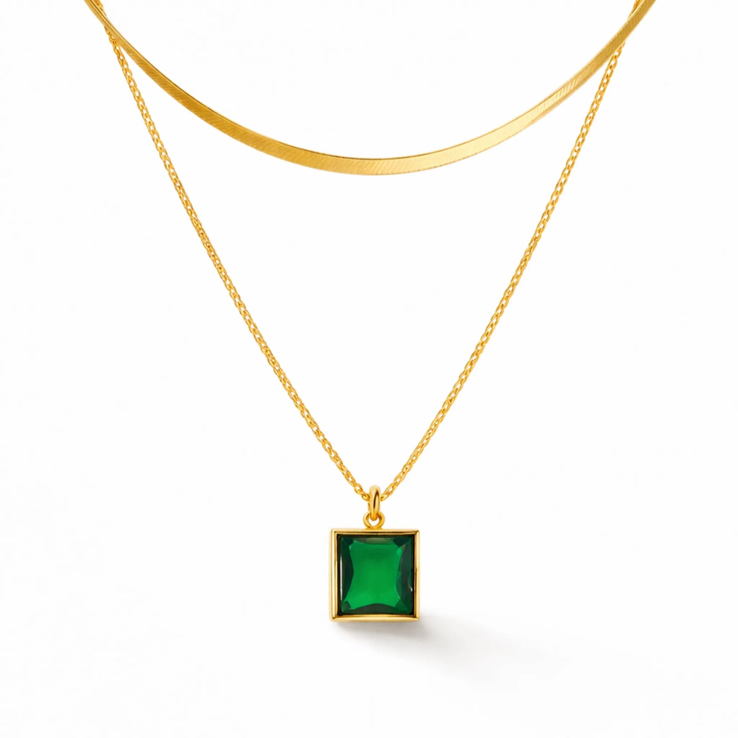 Close-up of YUBIRAA emerald square pendant double layer in gold finish, anti tarnish stainless steel necklace