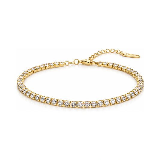 Gold bracelet with clear stones on a white background