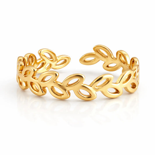 Minimal gold leaf loop ring with open leaf pattern, adjustable band on white background