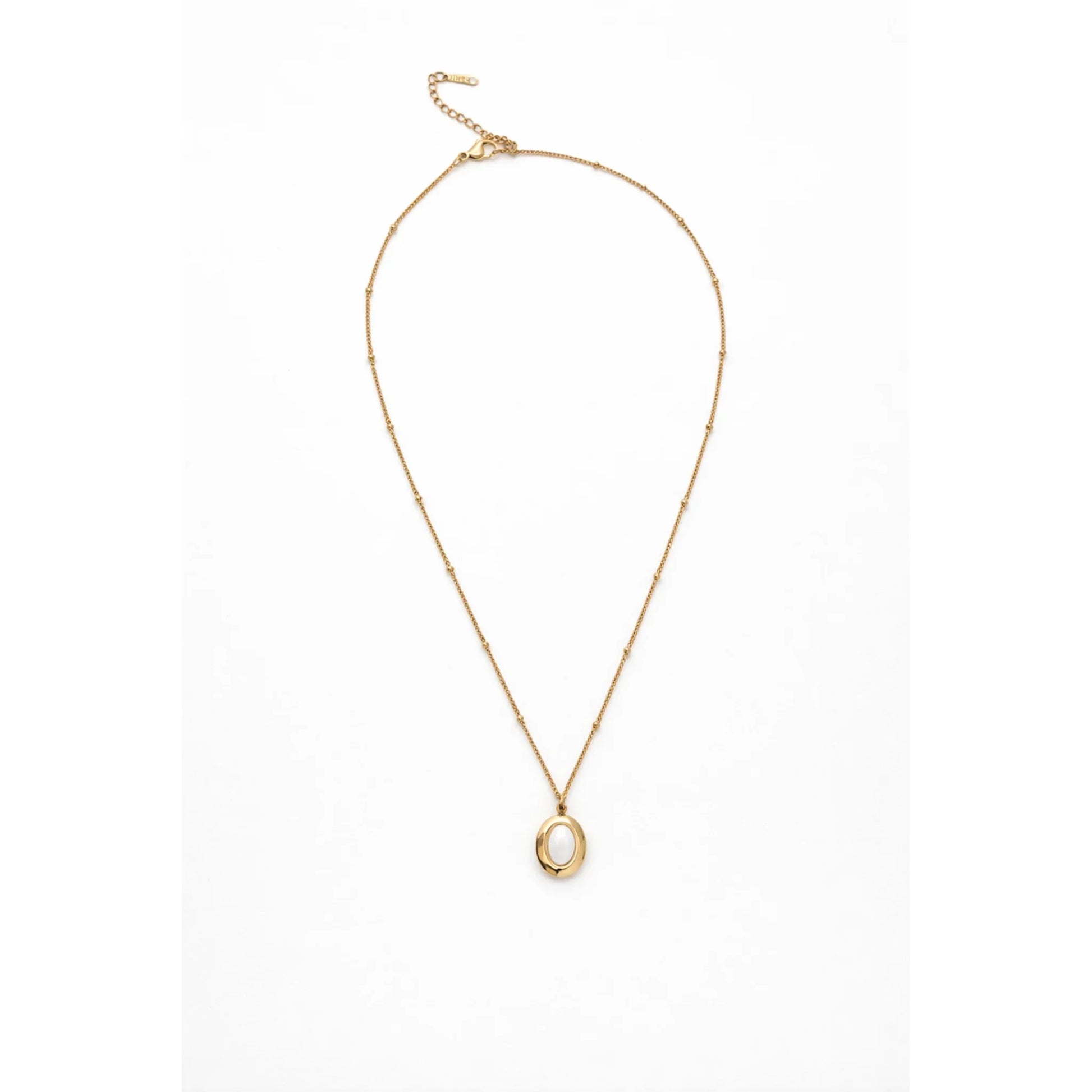 Minimal gold chain necklace with oval opal pendant shown full length in flat lay on white background