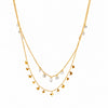 Butterfly Spark layered gold necklace with crystal drop charms and delicate butterfly pendants