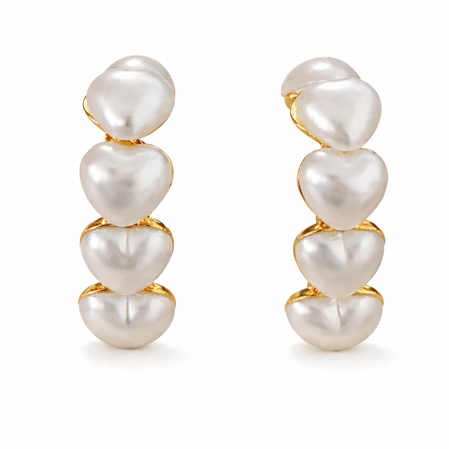 Pair of pearl earrings with gold accents on a white background