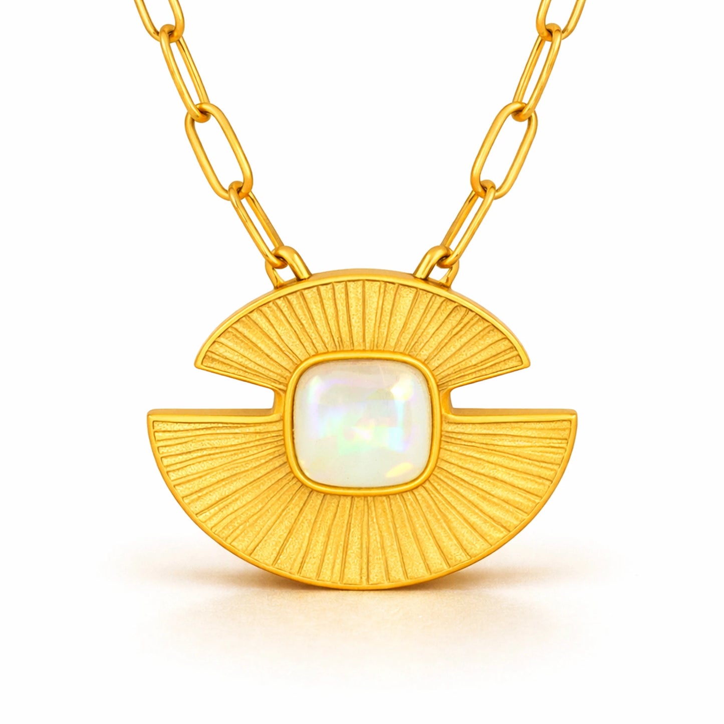 Close-up of gold stainless steel sunburst pendant featuring detailed texture and iridescent opal stone