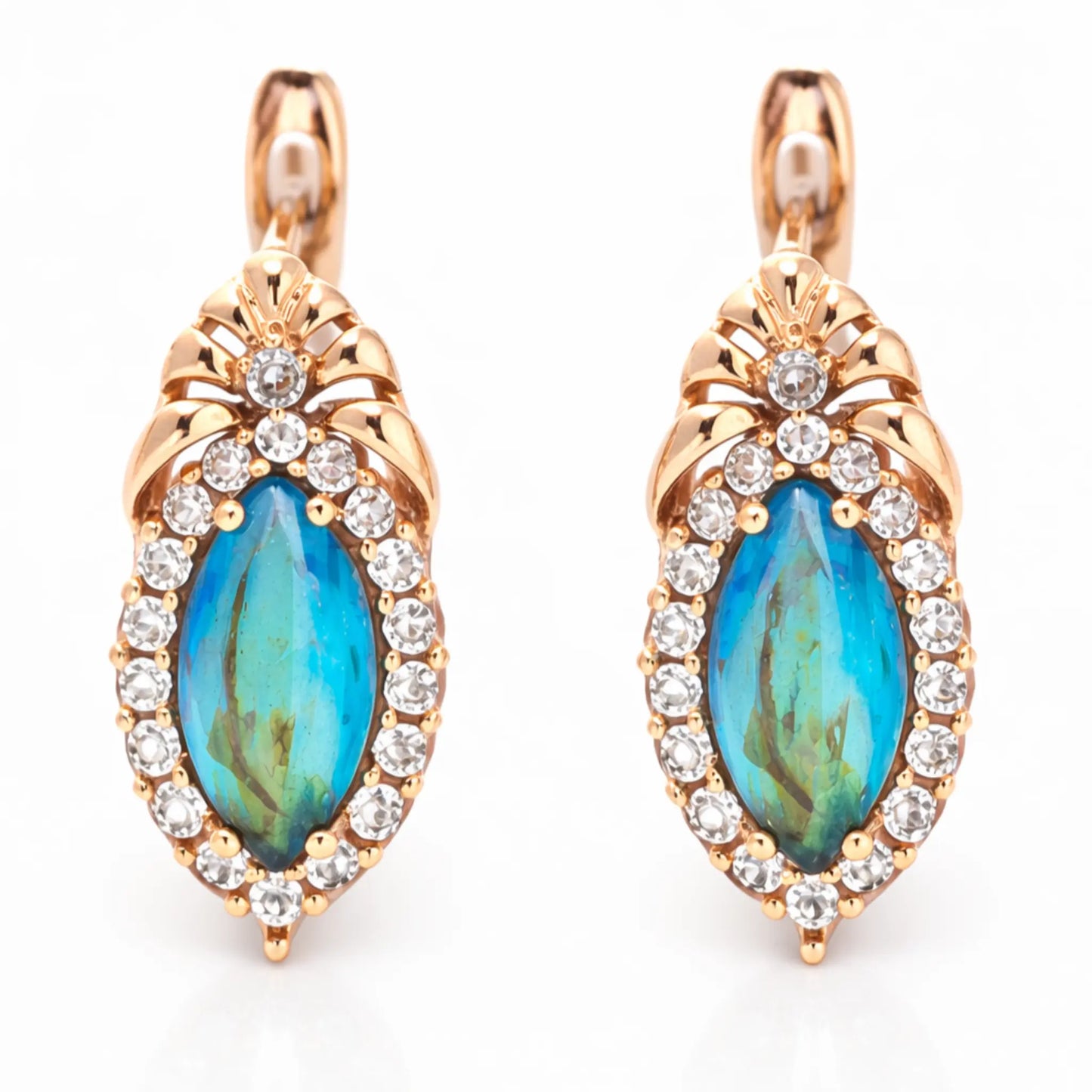 Close-up of anti tarnish gold polish blue gemstone earrings with crystal detailing