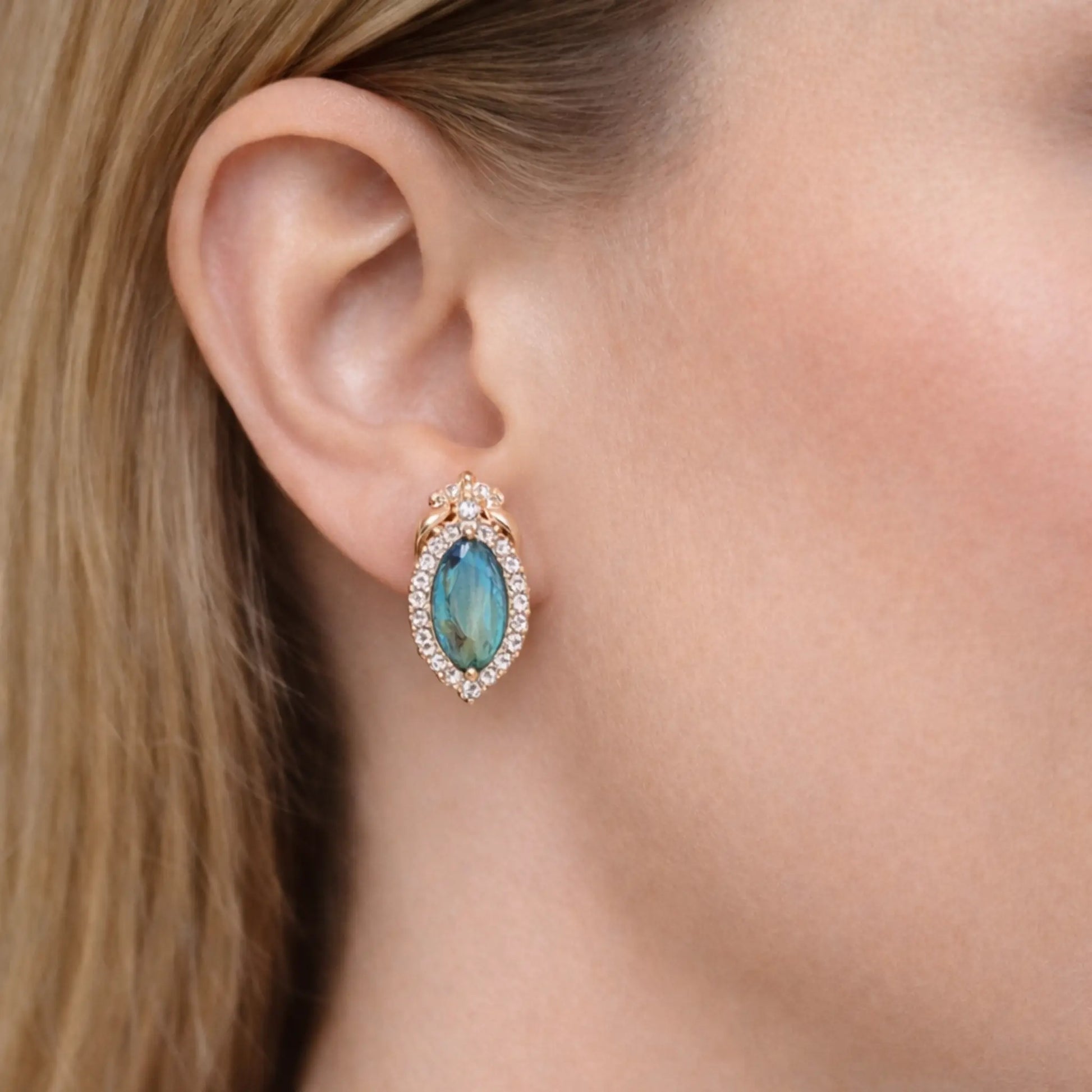 Anti tarnish gold polish blue stone earrings worn showcasing elegant drop design