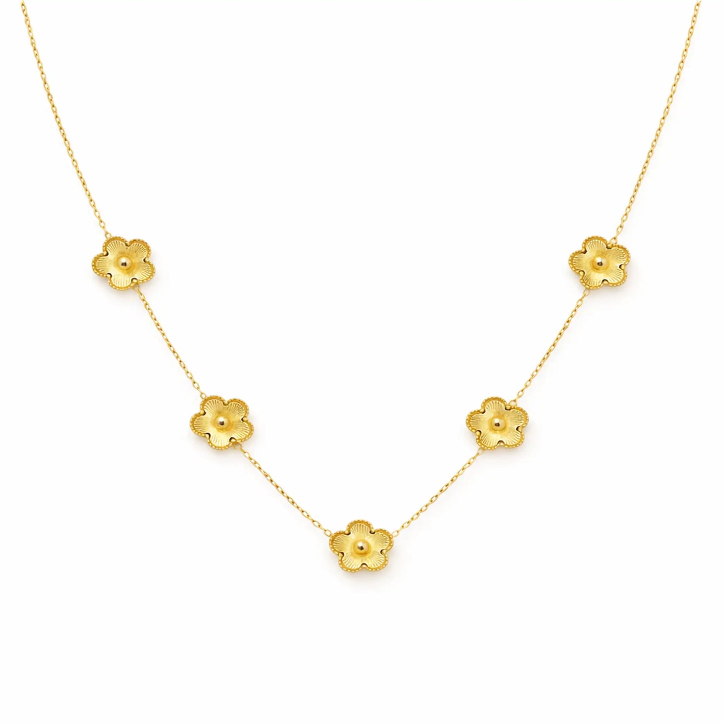 Gold necklace with floral pendants on a white background