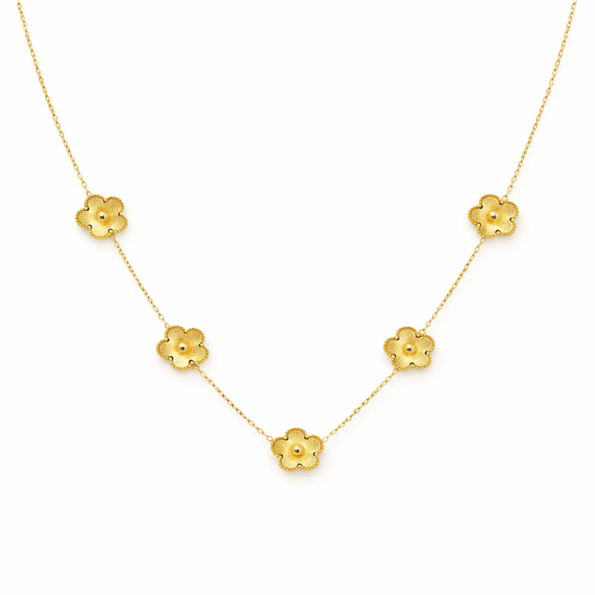 Gold necklace with floral pendants on a white background