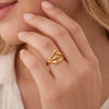 Model wearing YUBIRAA golden flow adjustable gold ring, statement sculptural jewellery styling