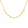 Gold necklace with closed heart and open heart pendants on a white background