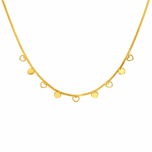 Gold necklace with closed heart and open heart pendants on a white background