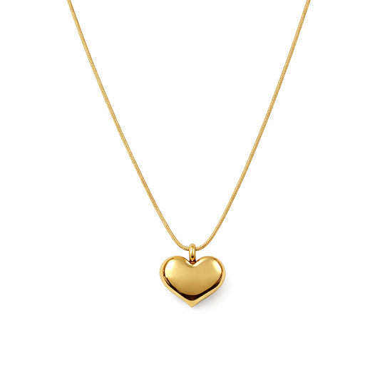 Gold heart-shaped pendant necklace on a white background
