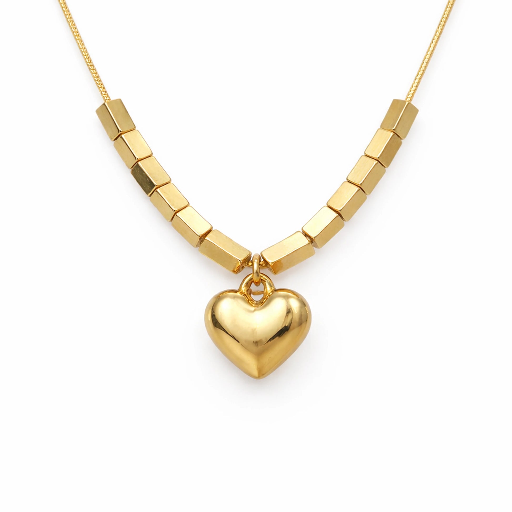 Gold necklace with a heart pendant on a white background