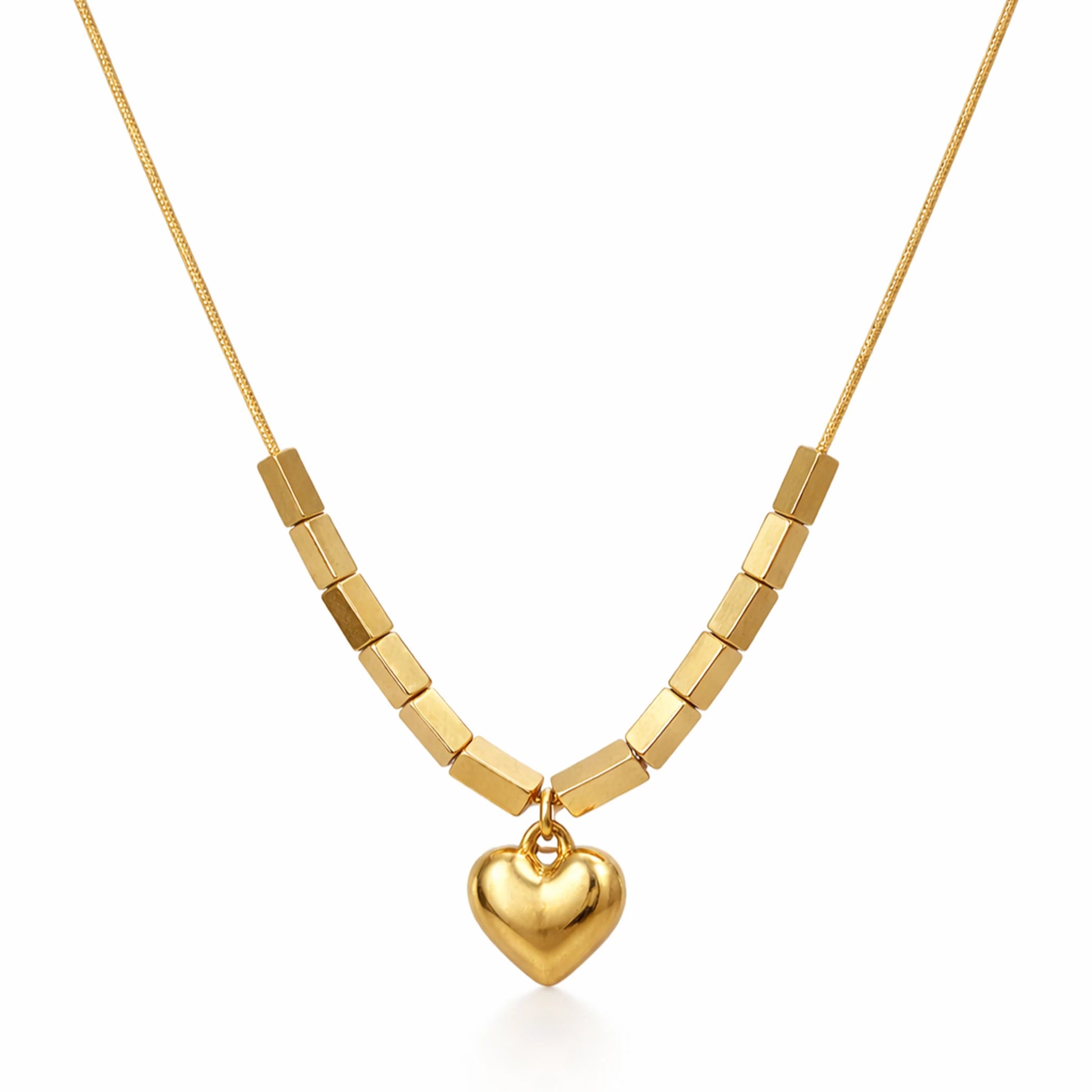 Gold necklace with a heart pendant on a white background