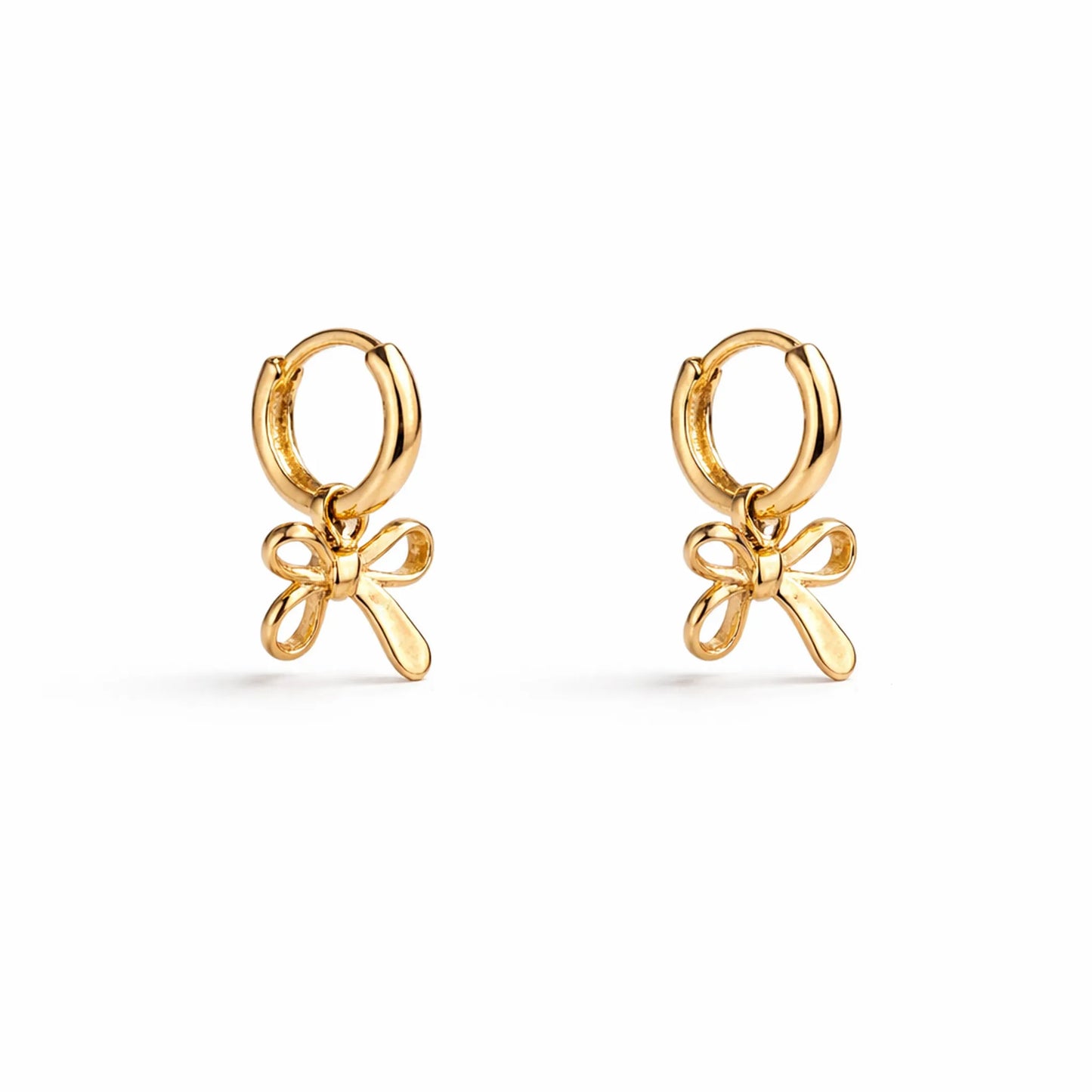 Gold bow-shaped earrings on a white background