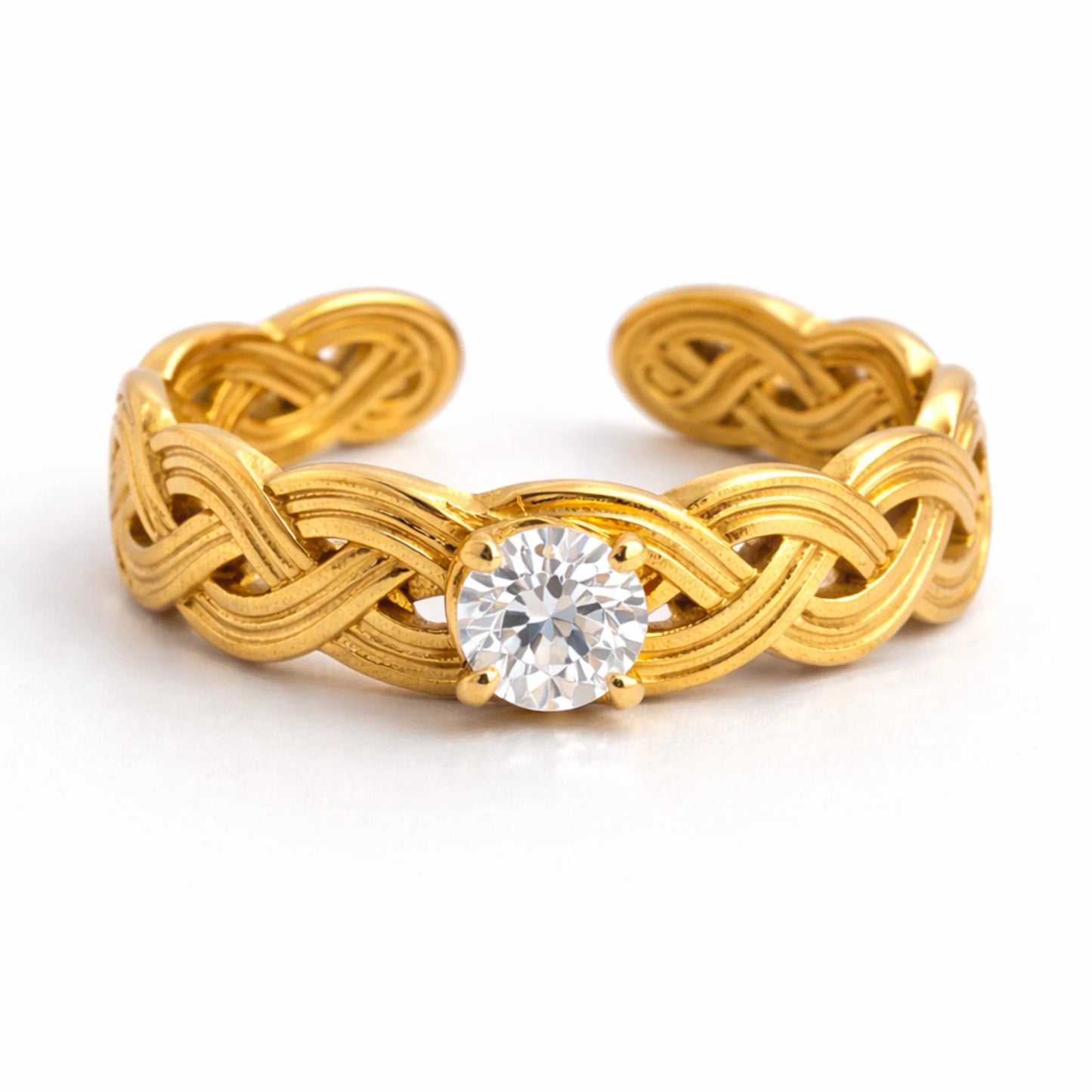 Side angle view of infinity knot solitaire ring with braided gold band and cubic zirconia